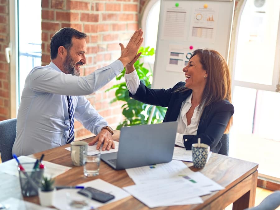 Two business partners reviewing numbers together.